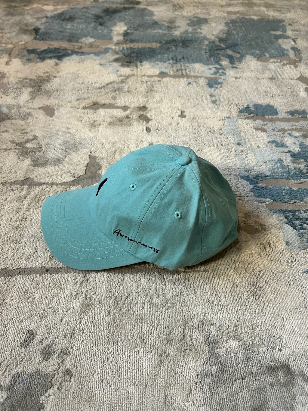 Turquoise baseball cap
