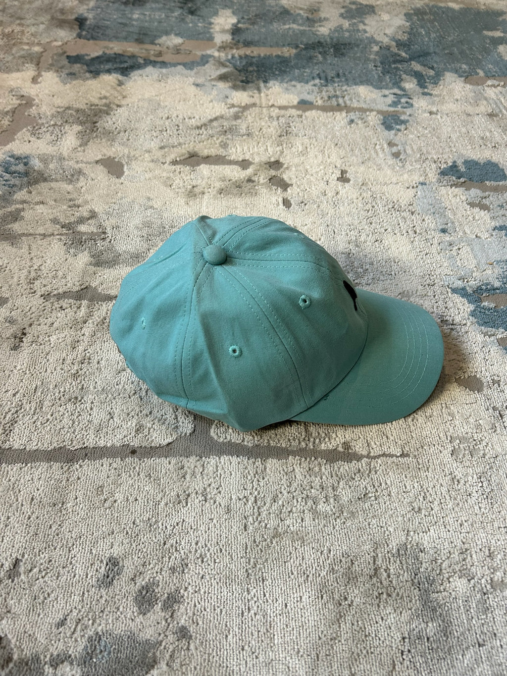 Turquoise baseball cap