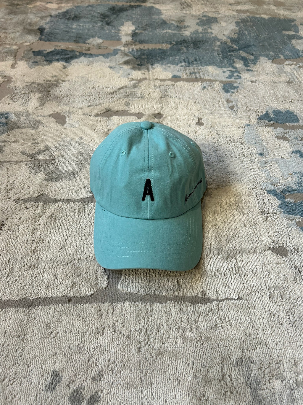 Turquoise baseball cap